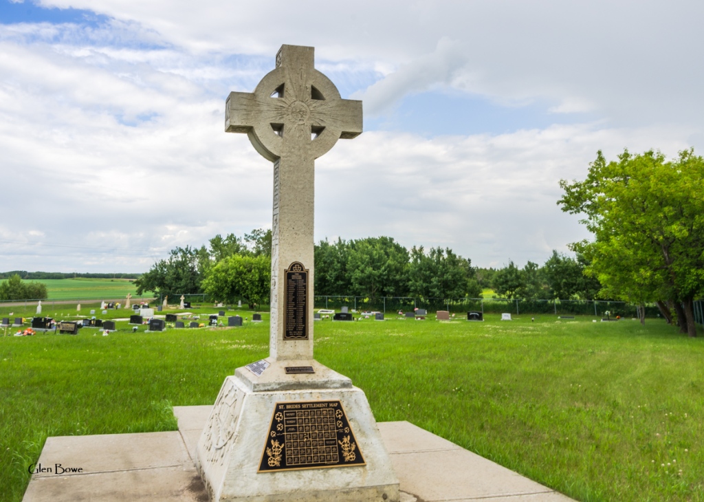 The Celtic cross with the cemetery in the background